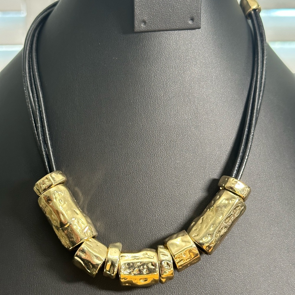 Chicos chunky hammered gold tube beads with four leather strands, NWOT